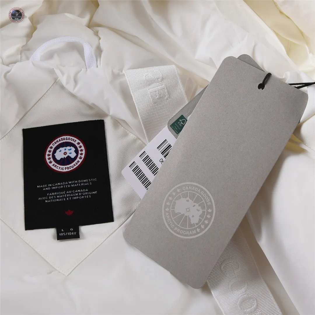 P840 🌟New model on sale! Canada Goose Paradigm Collection New Style 01 · Two-way front zipper with placket for extra coverage · Lightweight quilted down sleeves · Woven grab strap at upper back with "Canada Goose" logo patch · Sustainable Arctic Tech® elbow patches for durability · Rib knit hem and cuffs lock in heat · Suede tricot chin guard provides a soft touch Five external pockets: two handwarmer pockets, two lower pockets with flap closure, one utility pocket on the sleeve Three internal pockets: two drop-in pockets, one zippered pocket Internal straps allow the jacket to be worn over the shoulder, hands-free Color: Black White Sizes: XXS XS S M L XL XXL